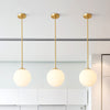 Single White Glass Orb Head Copper Pendant Light in Brass Finish