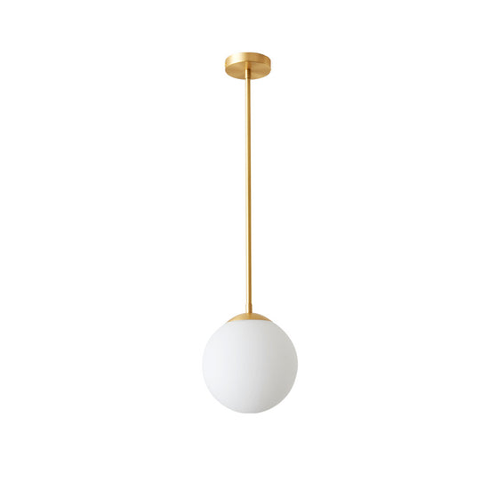 Single White Glass Orb Head Copper Pendant Light in Brass Finish