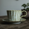 Antiqued Coffee Cup and Saucer Stoneware in Natural Tone