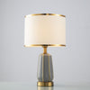 Simple Modern Ceramic Bedside Lamp with Drum Shade and Gold Trim