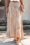 Peach Colored Boho Flower Print Smocked Waist Button Slit Maxi Skirt