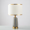 Simple Modern Ceramic Bedside Lamp with Drum Shade and Gold Trim